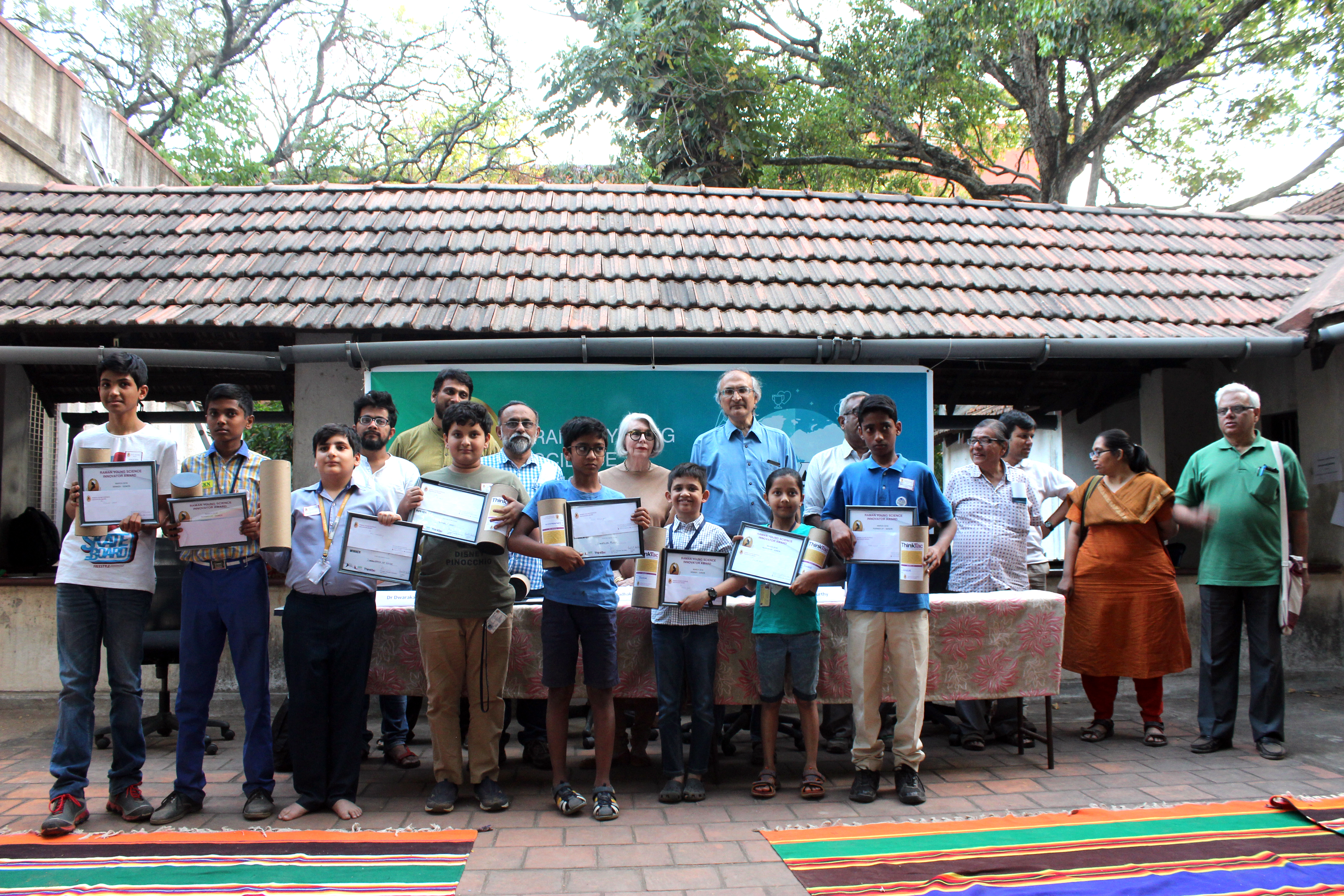 RYSI national award winners on stage, holding their certificates and medals